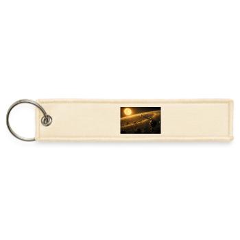 Golden Star Illuminating a Vast Space Rocks Belt - Jet Tag Keychain - creme - Front