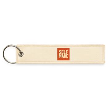 Handcrafted Pride Self Made T-Shirt Design - Jet Tag Keychain - creme - Front